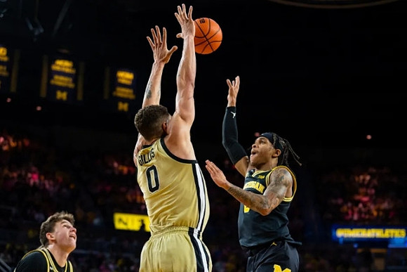 Will Tschetter (42) and Dug McDaniel (0)