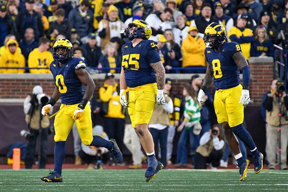 Josaiah Stewart (0), Mason Graham (55), and Derrick Moore (8)