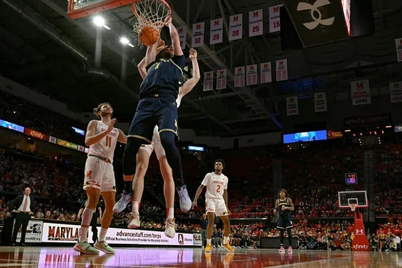 Hunter Dickinson (1) and Dug McDaniel (0)