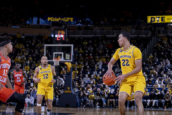 DeVante' Jones (12) and Caleb Houstan (22)