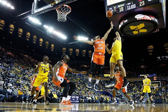 Moussa Diabate (14), Frankie Collins (10), and Brandon Johns Jr. (23)