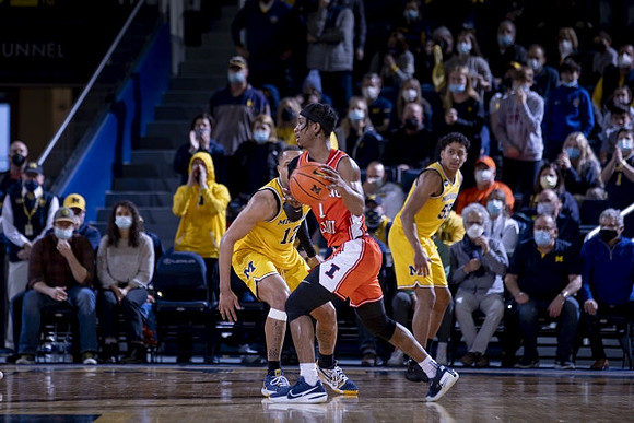 DeVante' Jones (12) and Eli Brooks (55)