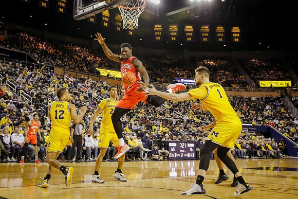 DeVante' Jones (12), Caleb Houstan (22), and Hunter Dickinson (1)