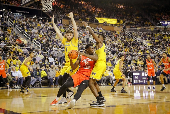 Hunter Dickinson (1), Moussa Diabate (14), Kobe Bufkin (2), and Eli Brooks (55)