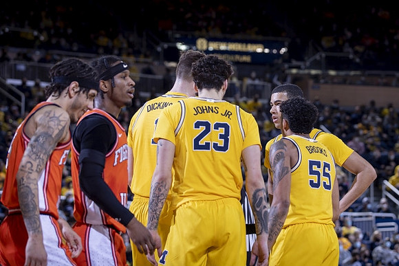 Hunter Dickinson (1), Brandon Johns Jr. (23), Eli Brooks (55), and Caleb Houstan (22)