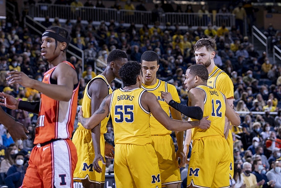 Moussa Diabate (14), Eli Brooks (55), Caleb Houstan (22), DeVante' Jones (12), and Hunter Dickinson (1)