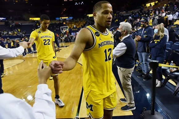 Caleb Houstan (22) and DeVante' Jones (12)