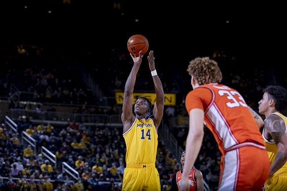 Moussa Diabate (14) and Eli Brooks (55)