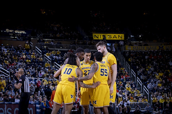 Frankie Collins (10), Moussa Diabate (14), Caleb Houstan (22), Eli Brooks (55), and Hunter Dickinson (1)