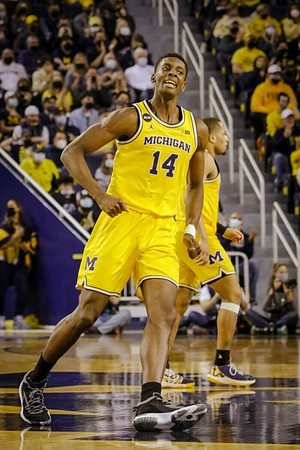 Moussa Diabate (14) and DeVante' Jones (12)