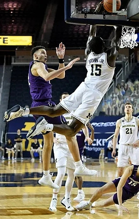 Hunter Dickinson (1), Chaundee Brown Jr. (15), and Franz Wagner (21)