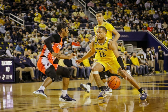 DeVante' Jones (12) and Caleb Houstan (22)