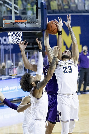 Isaiah Livers (2) and Brandon Johns Jr. (23)