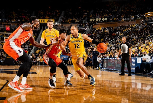 DeVante' Jones (12) and Hunter Dickinson (1)