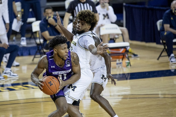 Mike Smith (12) and Chaundee Brown Jr. (15)