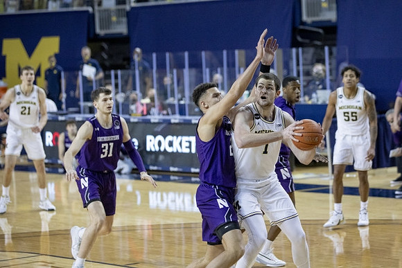 Franz Wagner (21), Hunter Dickinson (1), and Eli Brooks (55)
