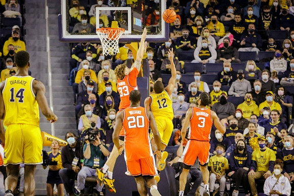 Moussa Diabate (14) and DeVante' Jones (12)