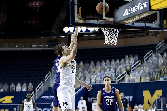 Franz Wagner (21) and Chaundee Brown Jr. (15)