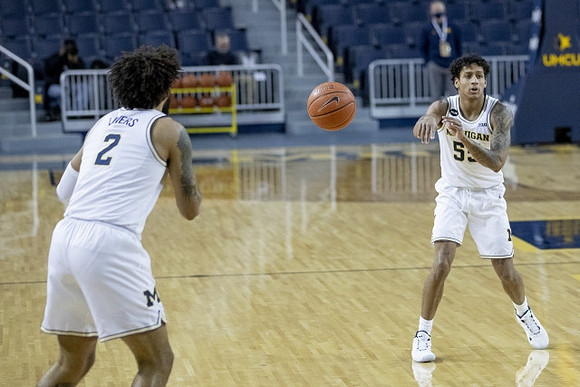 Isaiah Livers (2) and Eli Brooks (55)