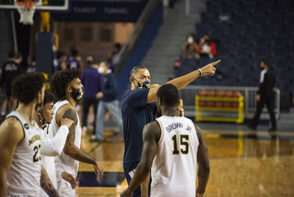 Brandon Johns Jr. (23), Isaiah Livers (2), Chaundee Brown Jr. (15), and Juwan Howard
