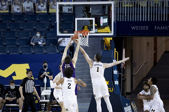 Franz Wagner (21), Isaiah Livers (2), Hunter Dickinson (1), Mike Smith (12), and Eli Brooks (55)