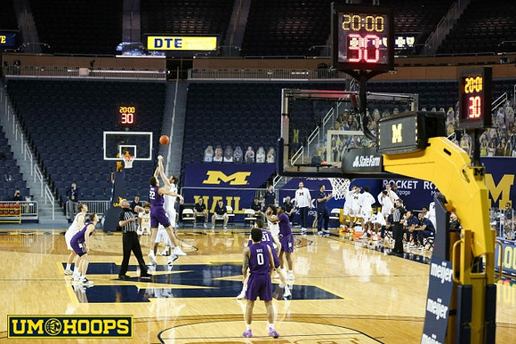 Franz Wagner (21), Hunter Dickinson (1), Mike Smith (12), and Isaiah Livers (2)