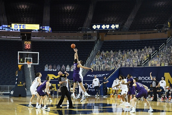 Franz Wagner (21), Hunter Dickinson (1), and Isaiah Livers (2)
