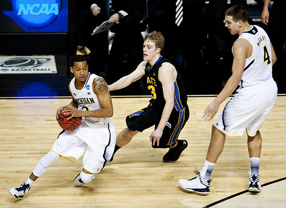 Trey Burke (3) and Mitch McGary (4)