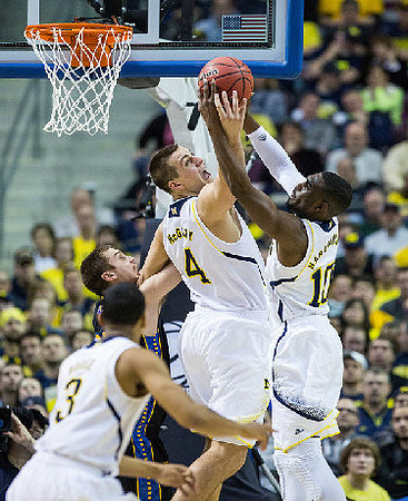 Trey Burke (3), Mitch McGary (4), and Tim Hardaway Jr. (10)