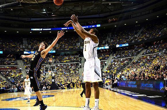 Glenn Robinson III (1) and Trey Burke (3)