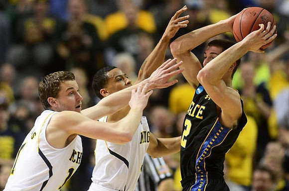 Nik Stauskas (11) and Trey Burke (3)