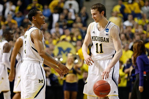 Trey Burke (3) and Nik Stauskas (11)