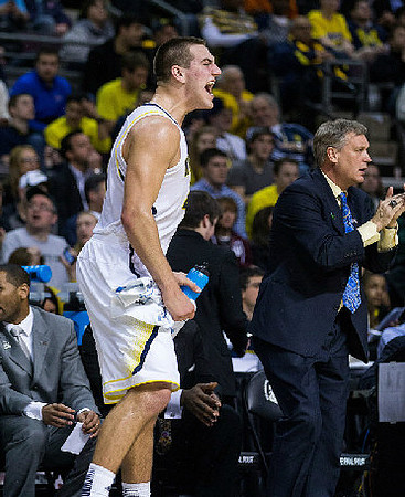 Mitch McGary (4) and Jeff Meyer
