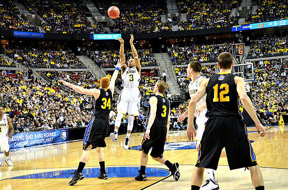 Trey Burke (3) and Mitch McGary (4)
