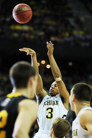 Trey Burke (3) and Mitch McGary (4)
