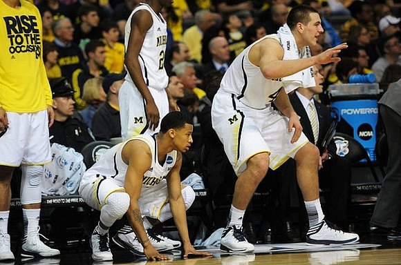 Trey Burke (3), Spike Albrecht (2), and Mitch McGary (4)