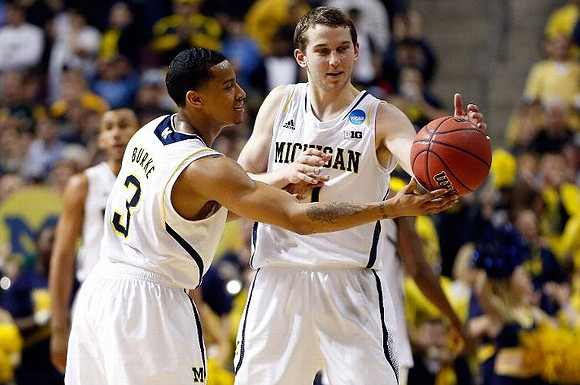 Trey Burke (3), Nik Stauskas (11), and Jon Horford (15)