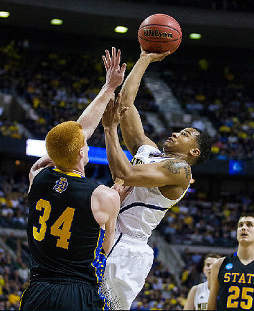 Trey Burke (3) and Nik Stauskas (11)