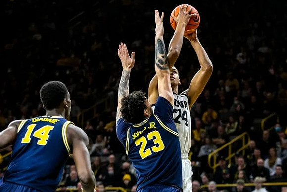 Moussa Diabate (14) and Brandon Johns Jr. (23)