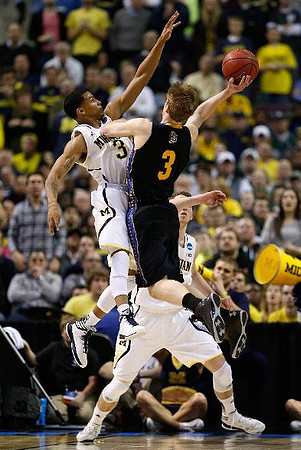 Trey Burke (3) and Nik Stauskas (11)
