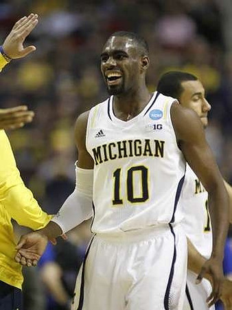 Tim Hardaway Jr. (10) and Jon Horford (15)