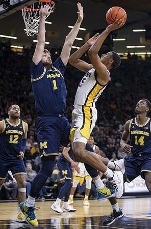 DeVante' Jones (12), Hunter Dickinson (1), and Moussa Diabate (14)