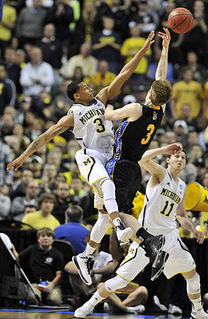 Trey Burke (3) and Nik Stauskas (11)