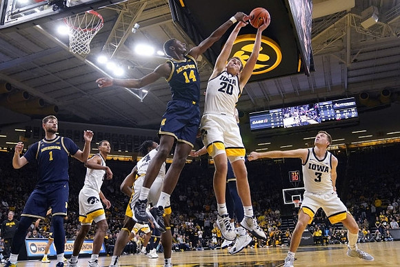 Hunter Dickinson (1) and Moussa Diabate (14)