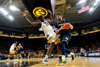 Hunter Dickinson (1) and DeVante' Jones (12)
