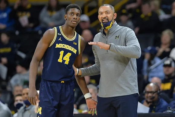 Moussa Diabate (14) and Juwan Howard