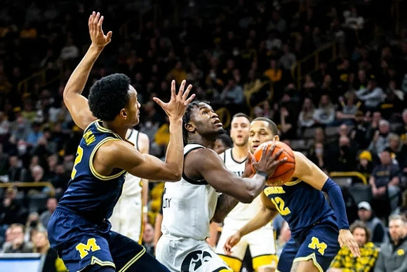 Kobe Bufkin (2) and DeVante' Jones (12)