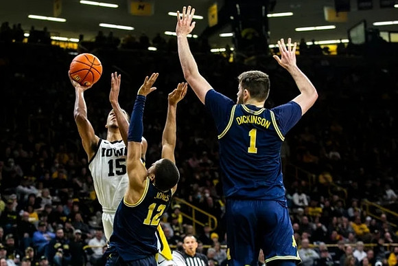 DeVante' Jones (12) and Hunter Dickinson (1)