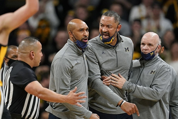Saddi Washington, Juwan Howard, and Phil Martelli