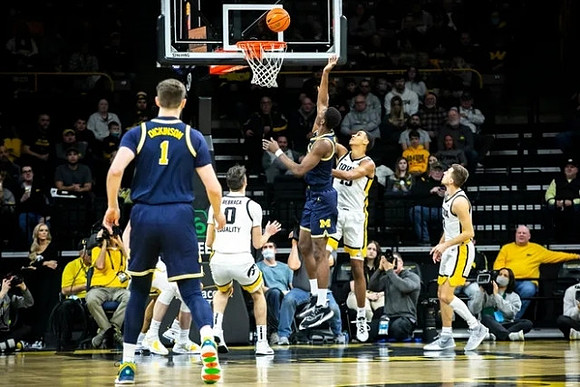 Hunter Dickinson (1) and Moussa Diabate (14)